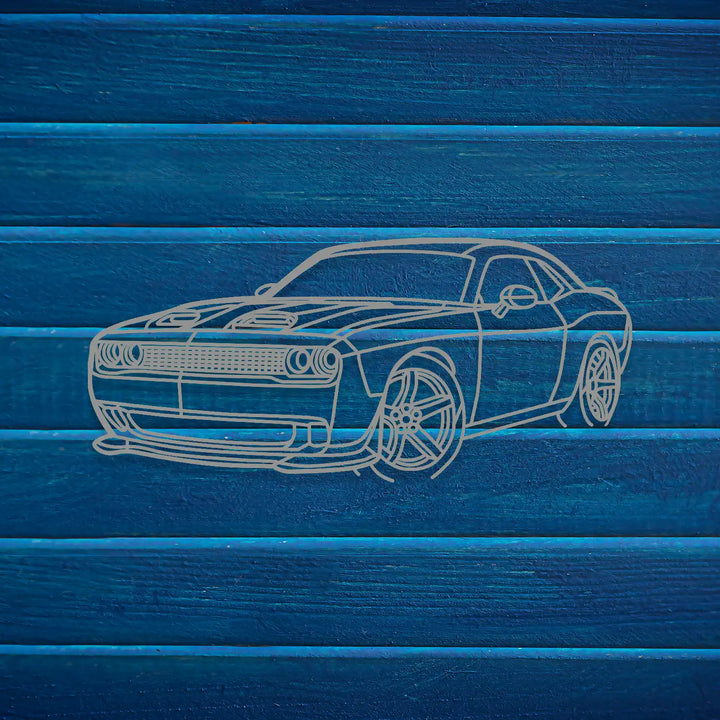 Black ferrous metal car art displayed above a modern desk setup.