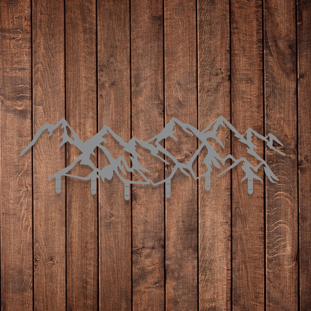 Sleek black metal mountain range wall decor with built-in hooks.