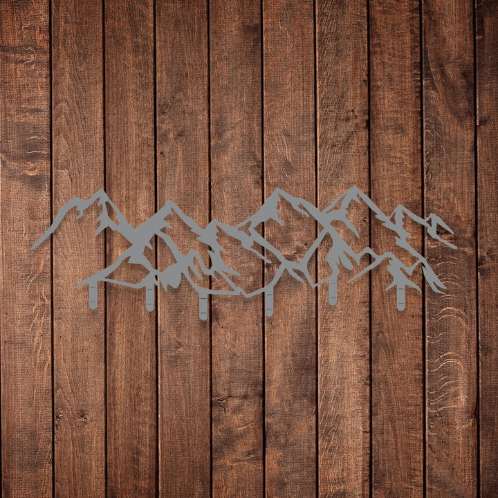 Sleek black metal mountain range wall decor with built-in hooks.