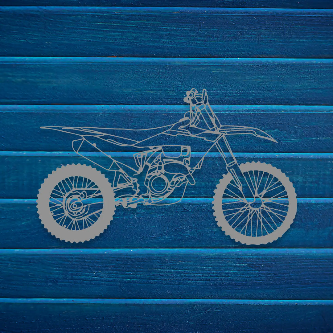 Off-road motorcycle wall piece emphasizing strength and movement.