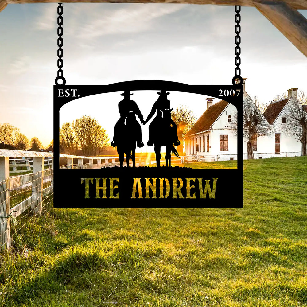 Custom outdoor ranch sign with two cowboys riding horses, established in 2007.