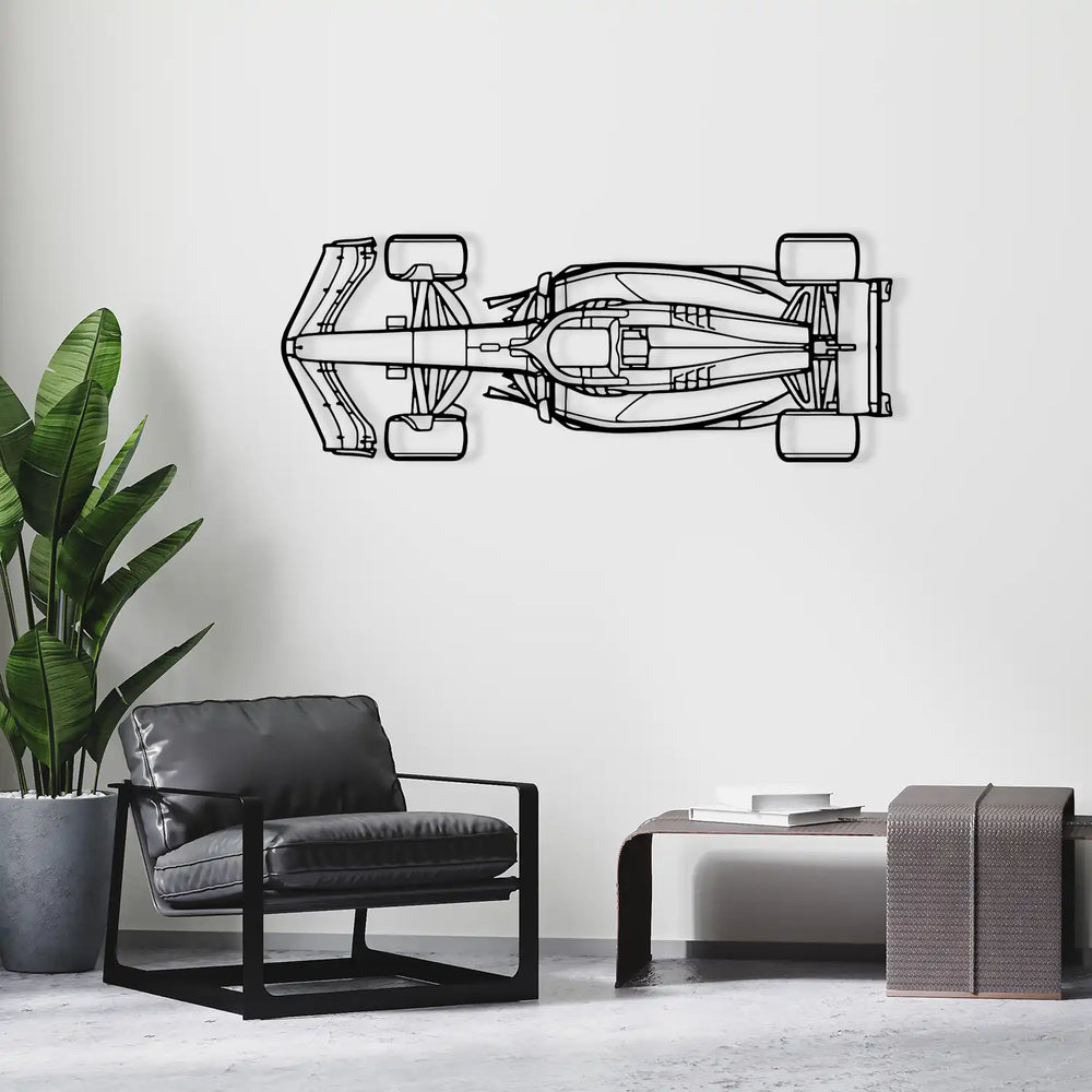 Detailed laser-cut metal F1 car seen from above, displayed above a sofa.