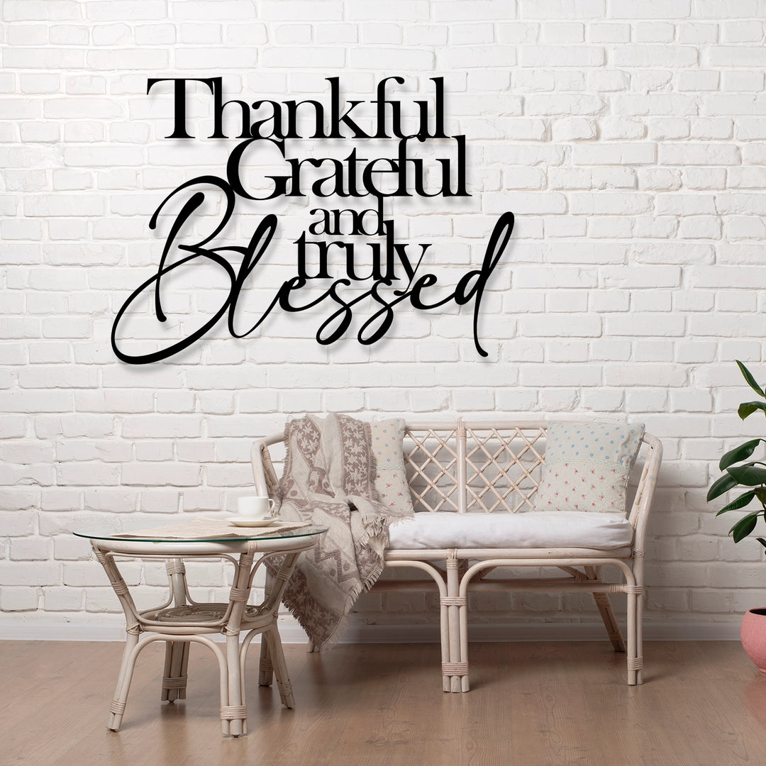 Black metal wall art with 'Thankful, Grateful, and Truly Blessed' text.