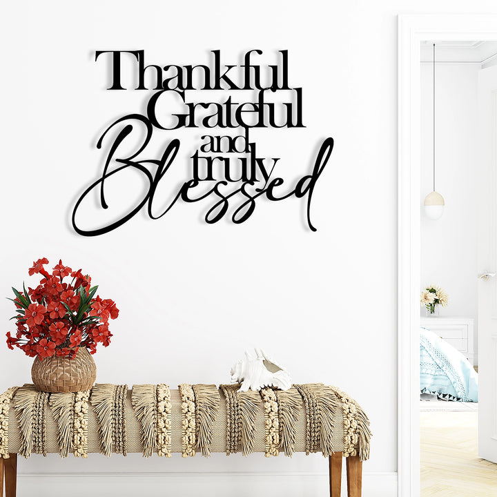 Elegant black metal typography wall decor with gratitude message.