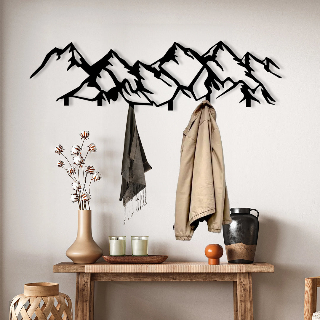 Black metal mountain range wall hook with multiple hanging points.