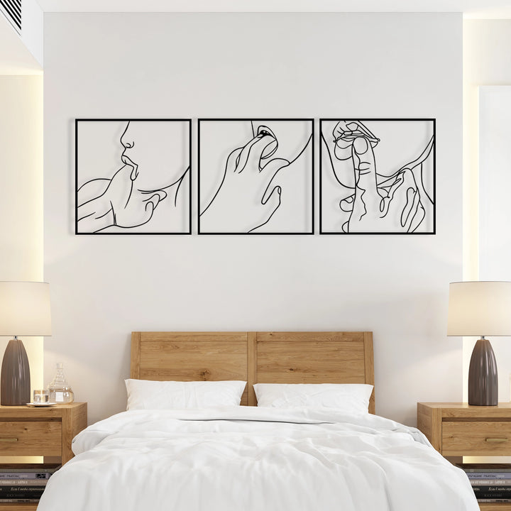 Minimalist sensual line art wall decor in black metal frames.