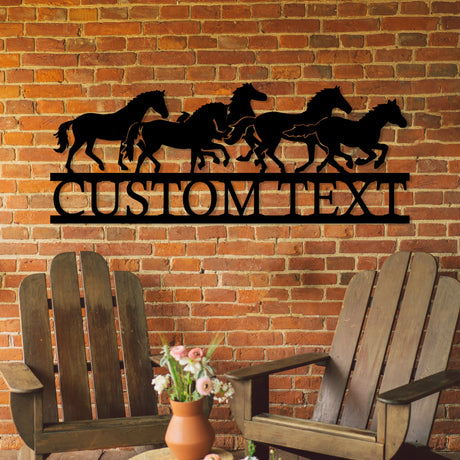Black metal garden sign with running horses design.